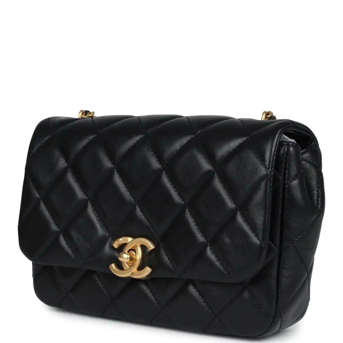 Black quilted lambskin flap bag with gold Chanel CC clasp and curved flap detail