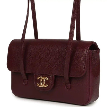 Mini clutch bag in dark burgundy caviar leather, front flap with CC emblem, side angle