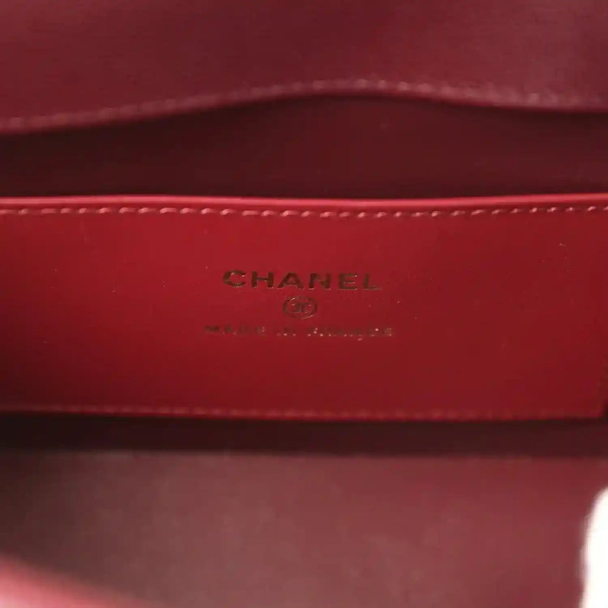 Mini clutch bag interior panel with CHANEL stamp and stitched border
