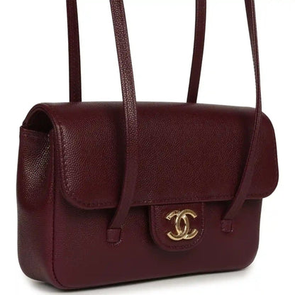 Mini clutch bag in dark burgundy caviar leather with front flap and CC turn-lock