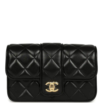 Chanel mini flap bag in black quilted lambskin with gold turn-lock