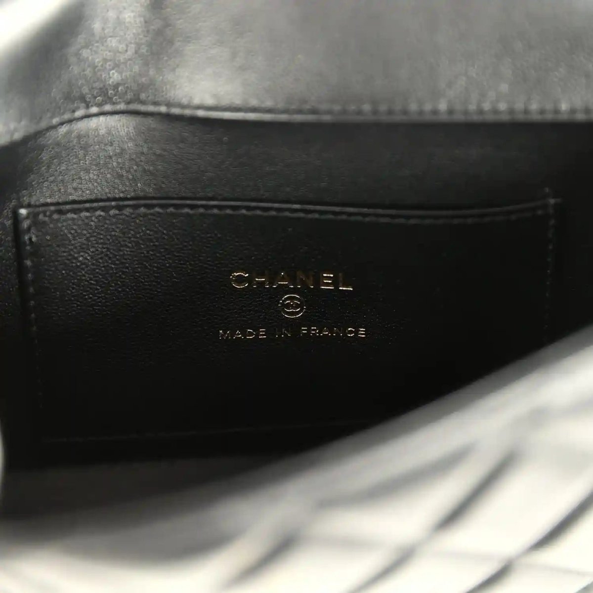 Chanel mini flap bag interior label reading CHANEL and Made in France