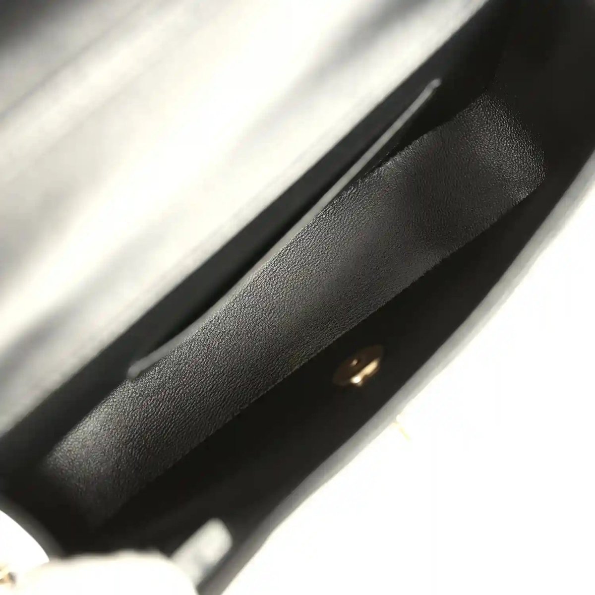 Chanel mini flap bag interior edge in black lambskin with gold hardware