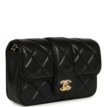Chanel mini flap bag in black quilted lambskin with gold CC turn-lock