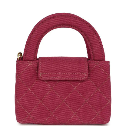 Fuchsia denim mini tote bag with quilted pattern, front flap, and gold CC clasp
