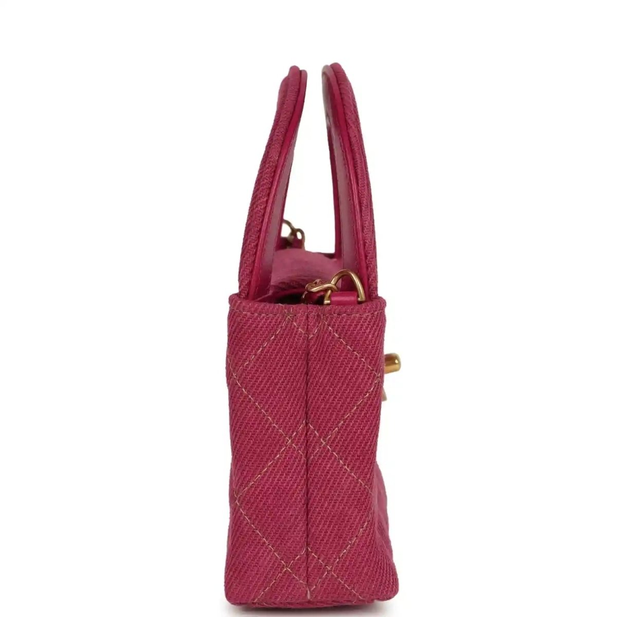 Fuchsia denim mini bag with two top handles and gold side hardware