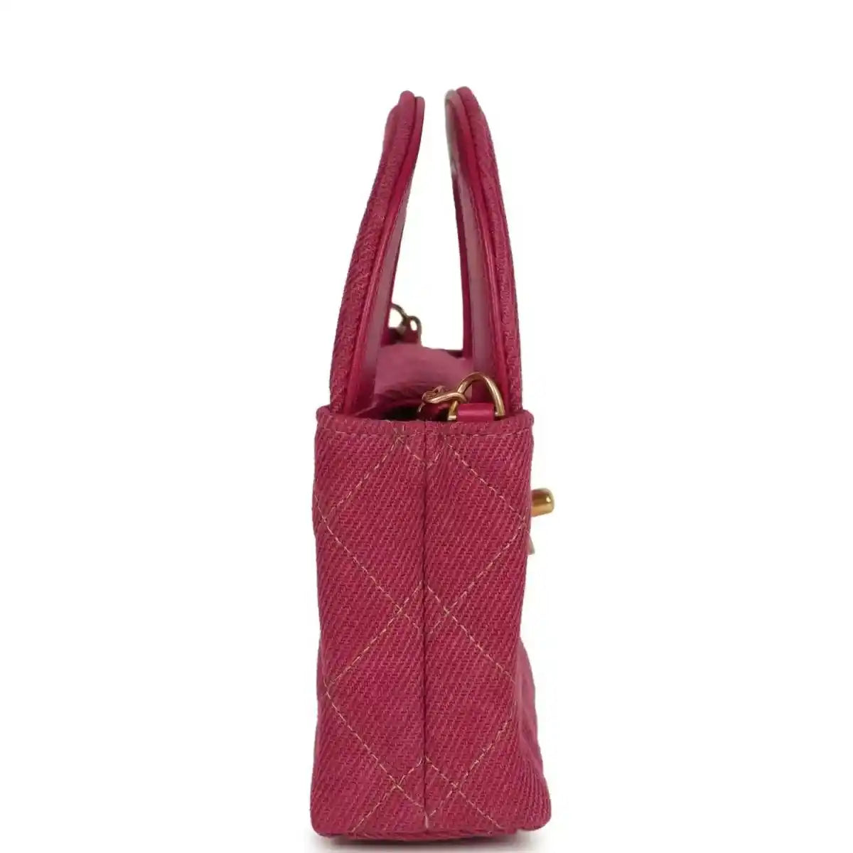 Fuchsia denim mini bag with two top handles and gold side hardware