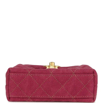 Fuchsia denim mini bag with quilted front and gold snap clasp on top flap