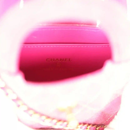 Fuchsia interior lining with embossed CHANEL logo and chain strap edge