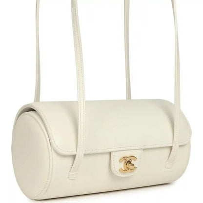 Chanel preppy bowling bag, white shiny caviar leather, side view with gold logo