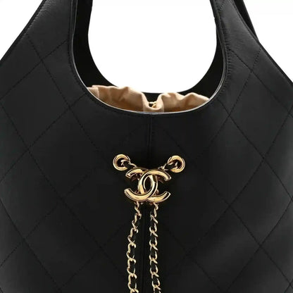 Chanel quilted calfskin tote bag front, black, gold CC emblem with chain drop