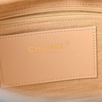 Tote bag interior CHANEL logo patch on beige lining with stitched border