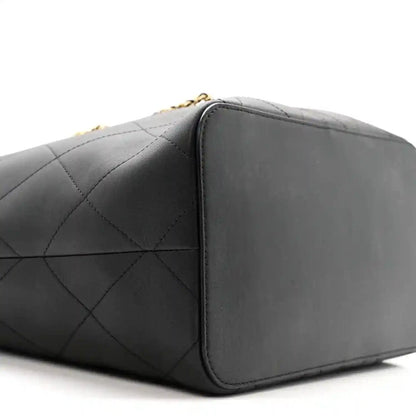 Quilted calfskin tote bag side, black, smooth panel with stitched edge