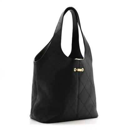 Chanel quilted calfskin tote bag, black, gold clasp detail and top handles