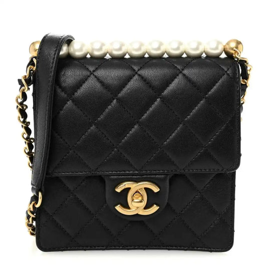 Chanel quilted black goatskin flap bag with faux pearl top detail and gold-tone CC clasp