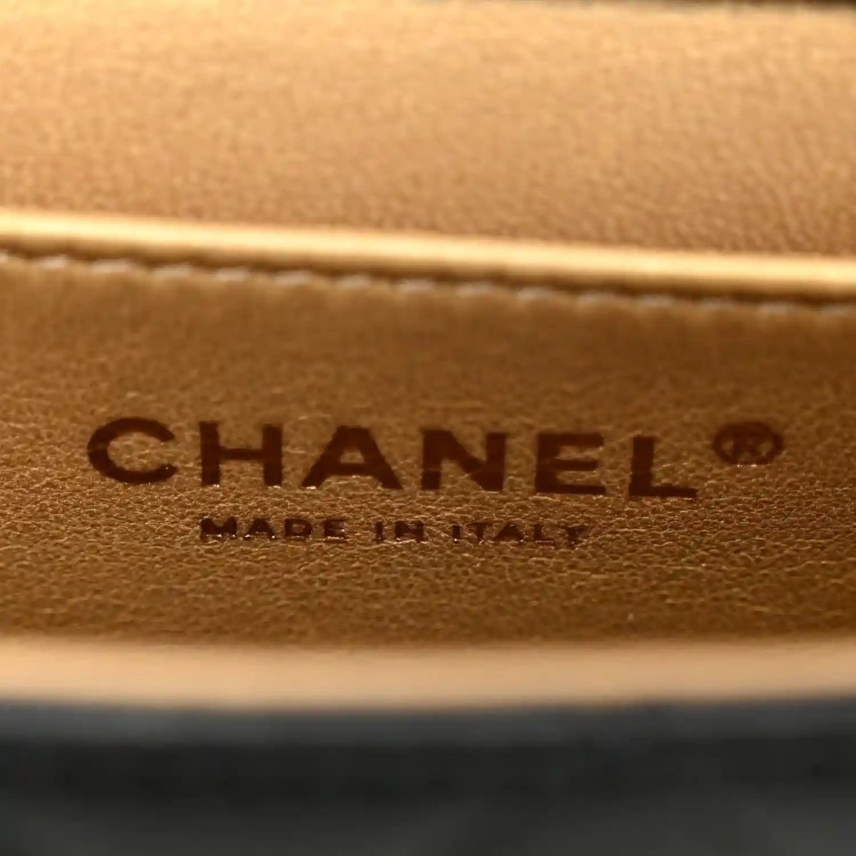 Chanel embossed leather logo patch on tan/brown interior