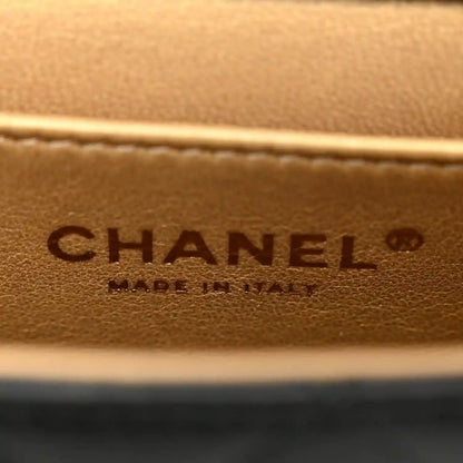 Chanel embossed leather logo patch on tan/brown interior