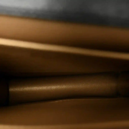 Chanel bag interior lining close-up in tan/brown leather