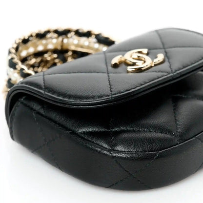 Black quilted lambskin clutch with gold CC clasp and chain, rounded top