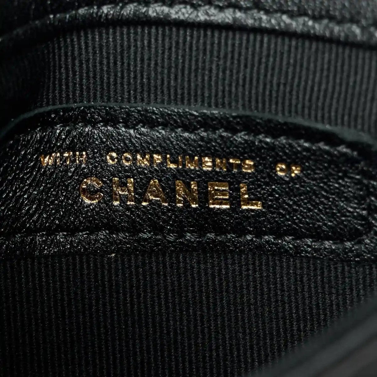 CHANEL embossed leather label inside pocket