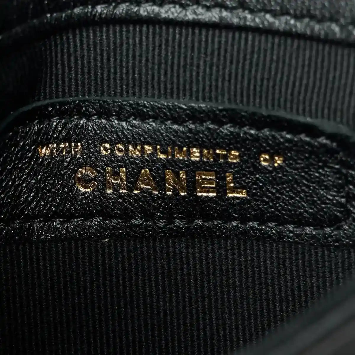 CHANEL embossed leather label inside pocket