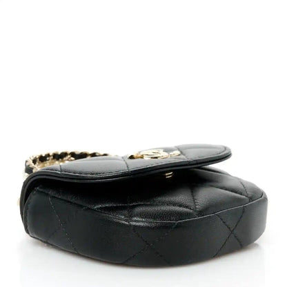 Black quilted leather clutch with hinged flap and gold-tone chain