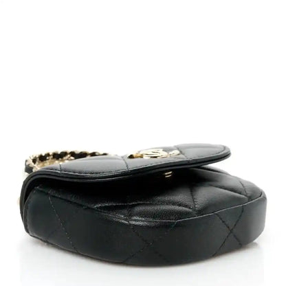 Black quilted leather clutch with hinged flap and gold-tone chain