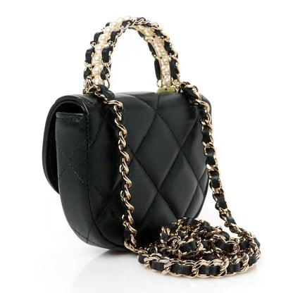 Black quilted leather top-handle clutch with long gold-tone chain strap