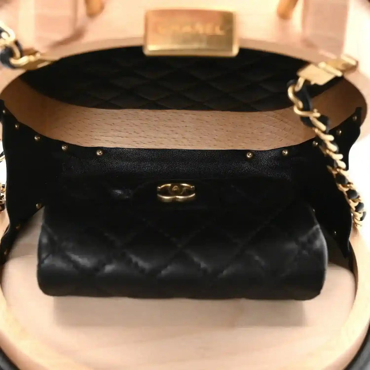 Chanel vanity case interior with black quilted lining and gold-toned clasp hardware