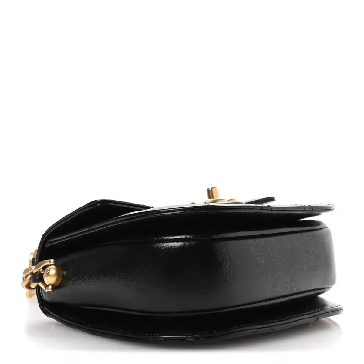 Black leather moon messenger bag side view with gold-tone clasp hardware