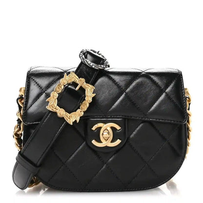 Black quilted calfskin moon messenger bag with gold buckle and chain strap