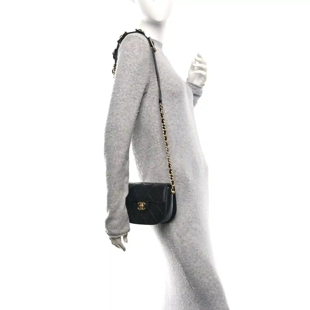 Black mini crossbody bag on chain strap with quilted design and small logo emblem