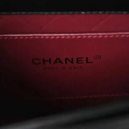 Red leather lining with CHANEL® and Made in Italy stamp