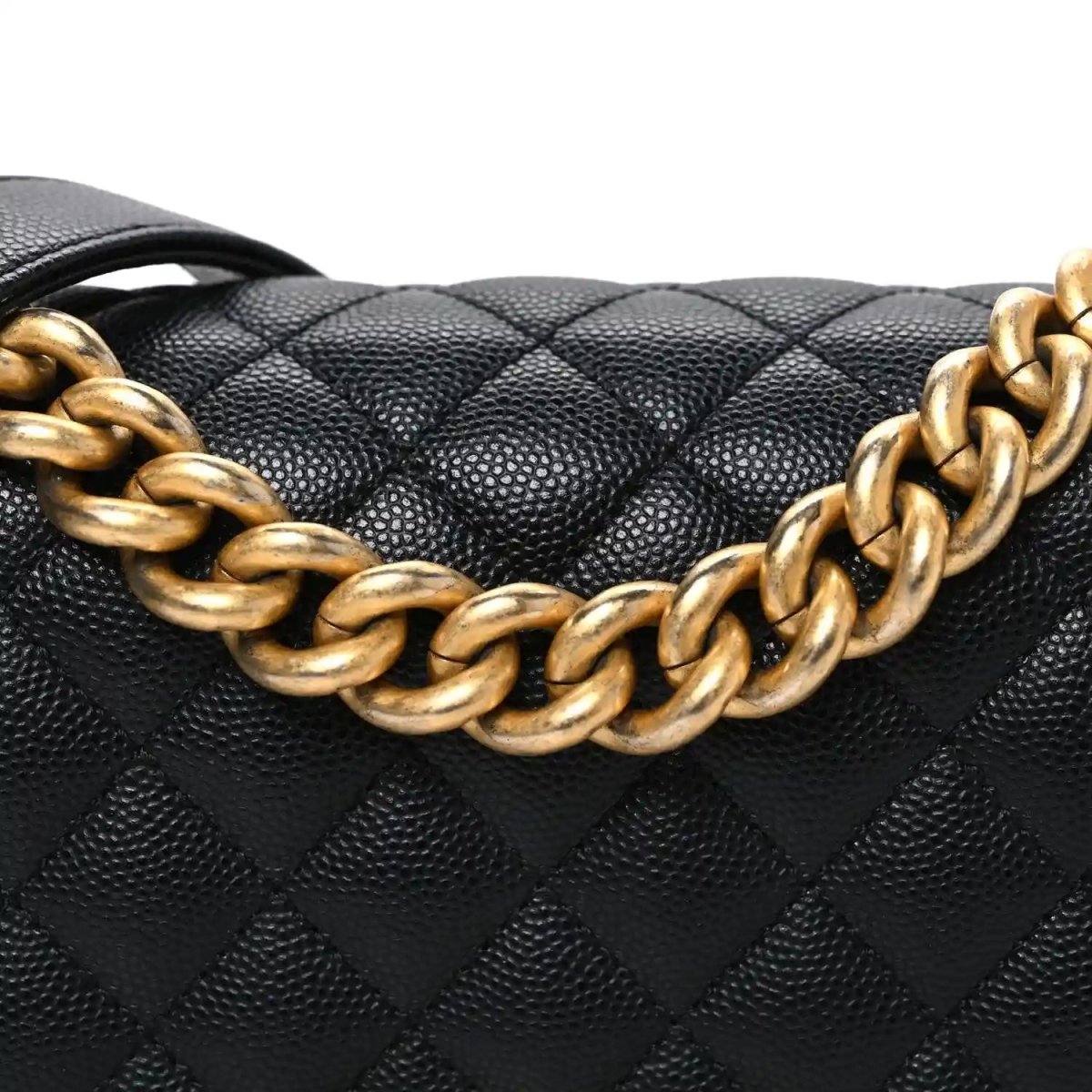 Black quilted caviar leather flap with gold-tone braided chain detail