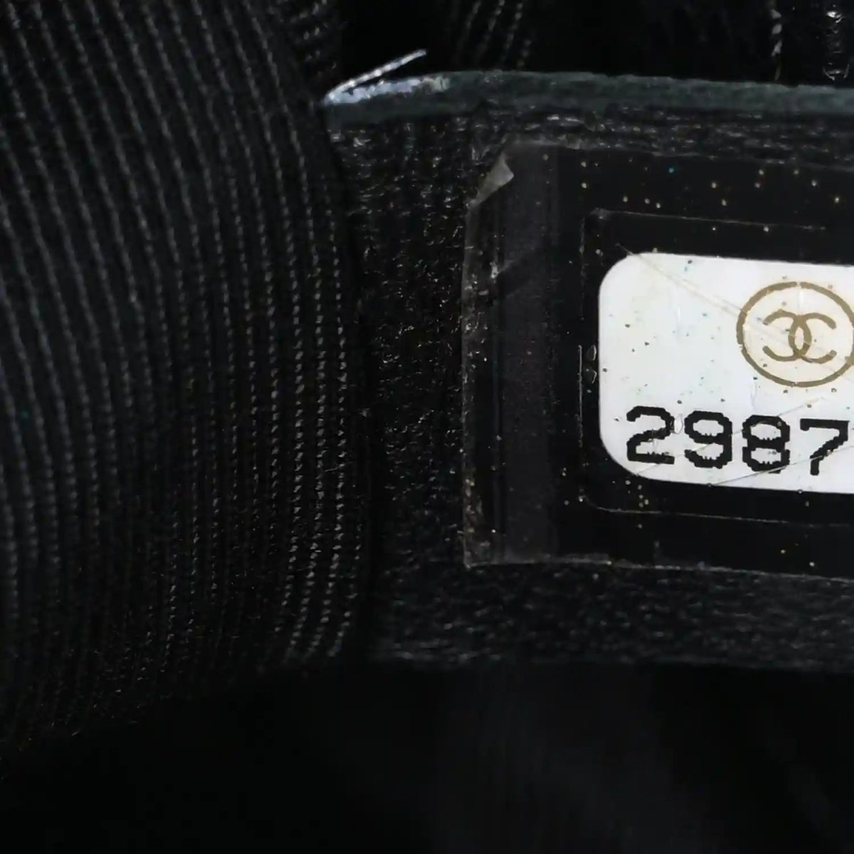 Black interior label area with Chanel logo and serial number tag