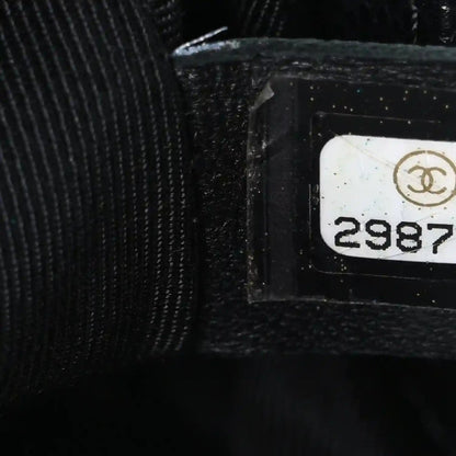 Black interior label area with Chanel logo and serial number tag