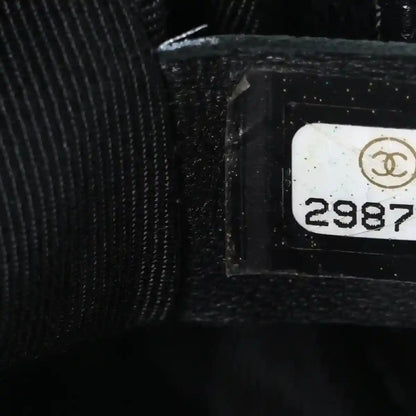 Black interior label area with Chanel logo and serial number tag