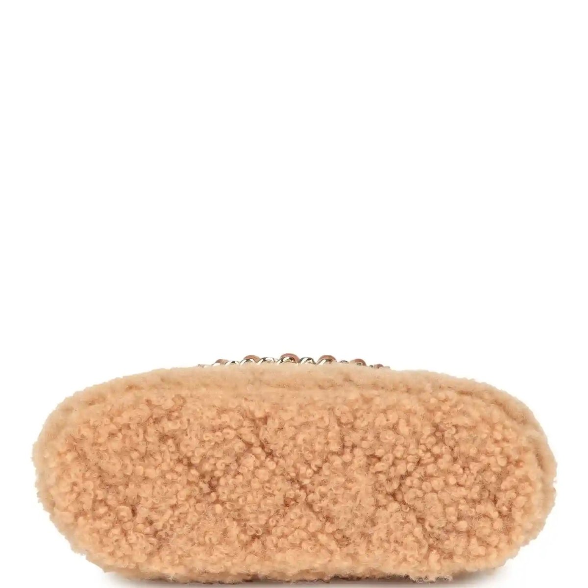 Beige shearling crossbody bag shown from the side with gold chain strap