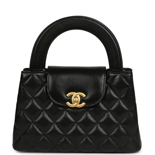 Chanel Kelly shopper bag in black quilted leather with gold CC clasp and top handles