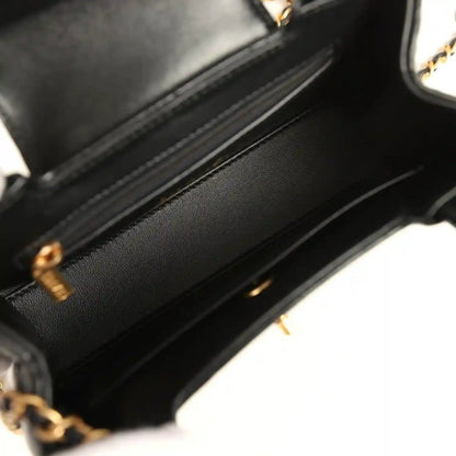 Chanel Kelly shopper bag interior view in black with top zipper opening and gold hardware