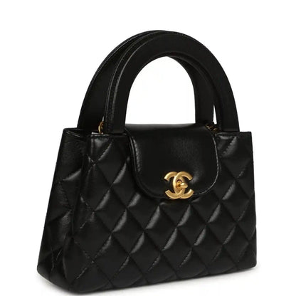 Chanel Kelly shopper bag in black quilted leather with front flap and gold CC clasp
