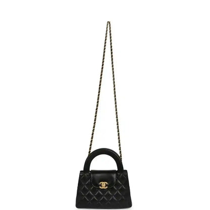 Chanel Kelly mini shopper bag in black quilted leather with long chain strap and CC detail