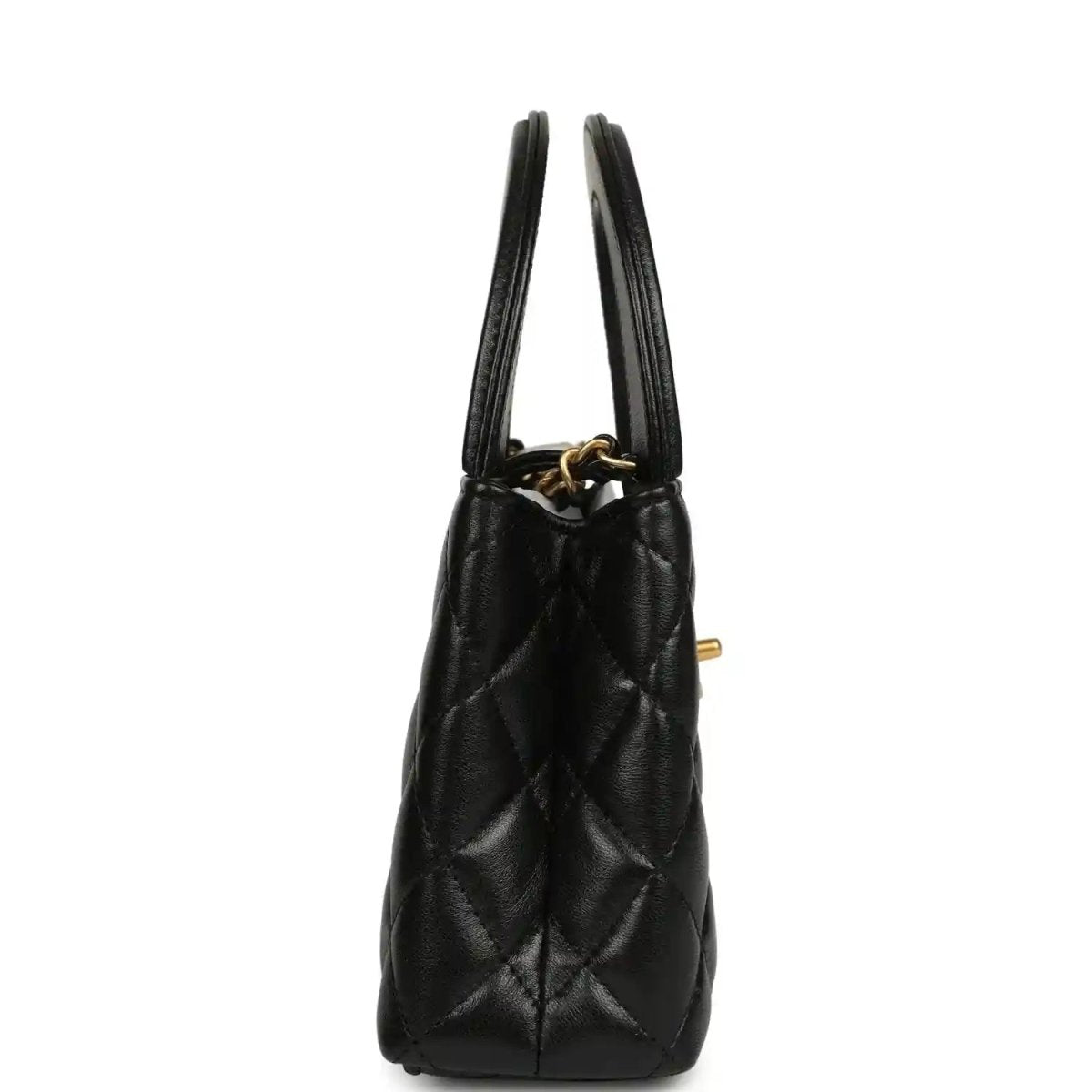 Chanel Kelly shopper bag in black quilted leather with side view and dual top handles