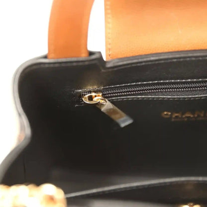 Chanel Small Kelly shopper bag zipper close-up with gold pull on black lining