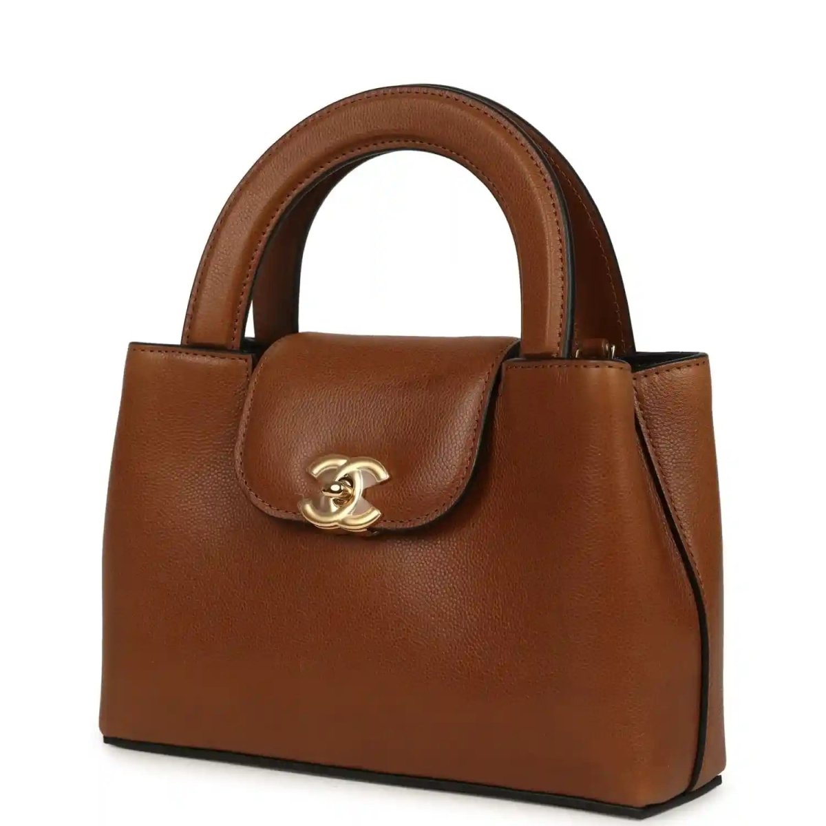 Chanel Small Kelly shopper bag in camel caviar leather, angled view with flap clasp