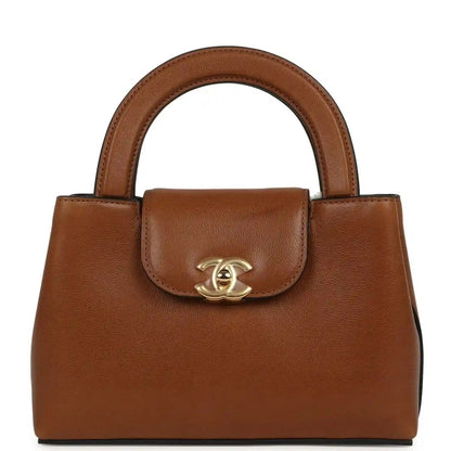 Chanel Small Kelly shopper bag in camel caviar leather with top handle and clasp