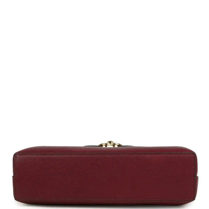 Dark burgundy caviar leather mini shopper bag base with top clasp hardware