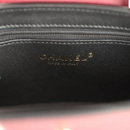 Dark interior label panel with CHANEL text and stitched zip top opening