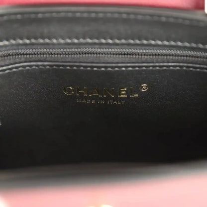 Dark interior label panel with CHANEL text and stitched zip top opening