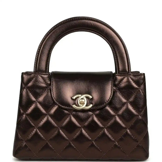Quilted small shopper bag in dark bronze with top handles and front flap clasp